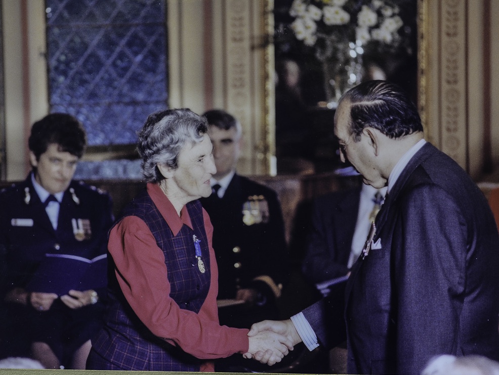 Image of Joan Giumelli receiving her OAM in 1997